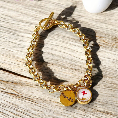 Gold plated Stainless Steel bracelet with floral charm