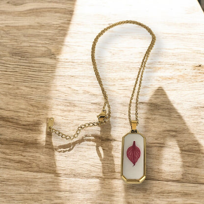Resin encasing a pressed flower petal pendant necklace - Gold plated Stainless Steel, Magenta petal