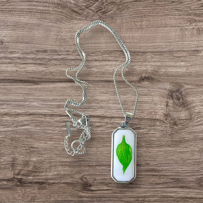 Resin encasing a pressed flower petal pendant necklace - Silver Stainless Steel, Green petal