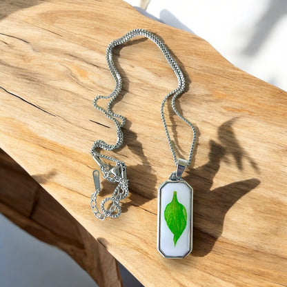 Resin encasing a pressed flower petal pendant necklace - Silver Stainless Steel, Green petal