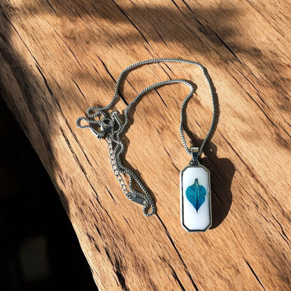Resin encasing a pressed flower petal pendant necklace - Silver Stainless Steel, Teal petal